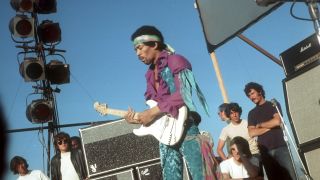 Rock guitarist Jimi Hendrix performs onstage with his Fender Stratocaster electric guitar at the Newport Pop Festival on June 20, 1969 in Devonshire Downs, California.