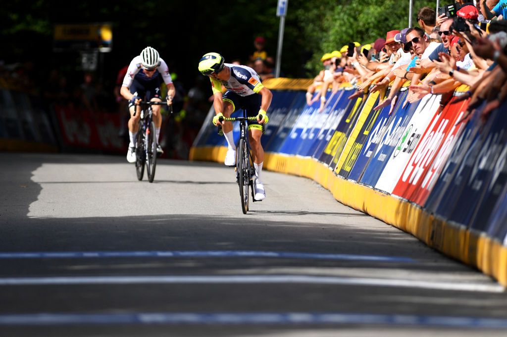 DURBUY BELGIUM JUNE 18 Quinten Hermans of Belgium and Team Intermarch Wanty Gobert Matriaux celebrates at finish line as stage winner ahead of Mauro Schmid of Switzerland and Team QuickStep Alpha Vinyl during the 91st Baloise Belgium Tour 2022 Stage 4 a 1722km stage from Durbuy to Durbuy BaloiseBelgiumTour on June 18 2022 in Durbuy Belgium Photo by Luc ClaessenGetty Images