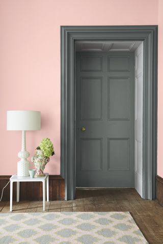 Pink room with dark grey door by Little Greene