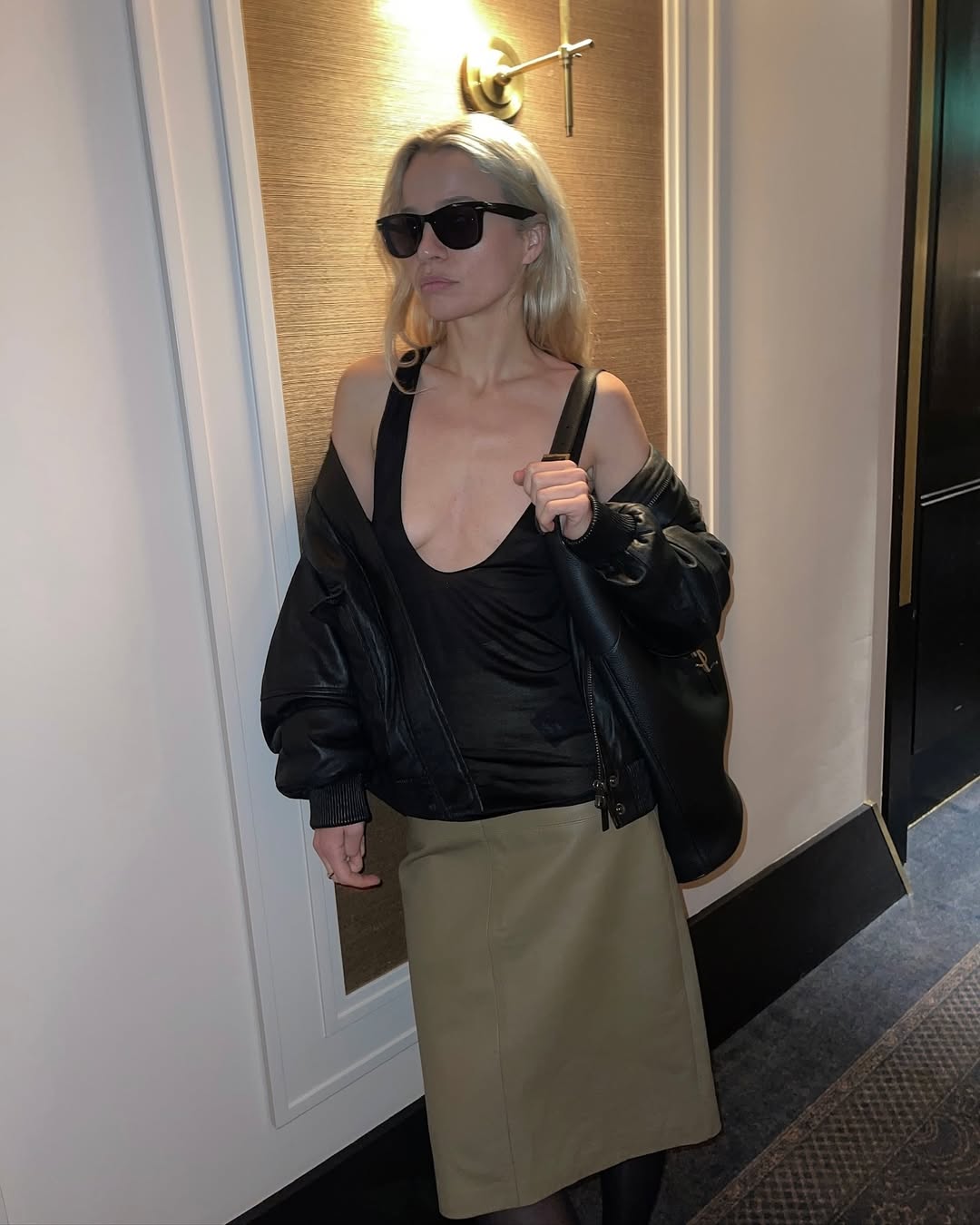 Stephanie Broek wearing a scoop-neck tank