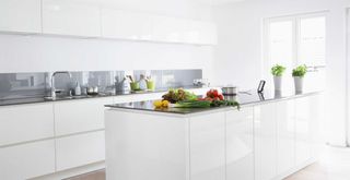 all-white minimalist kitchen demonstrating kitchen trends to avoid in 2023