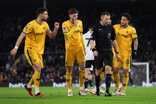 Joao Gomes of Wolverhampton Wanderers and Santiago Bueno of Wolverhampton Wanderers complains to Match referee Michael Salisbury during the Premier League match between Fulham FC and Wolverhampton Wanderers at Craven Cottage on November 27, 2023 in London, England. (Photo by Jacques Feeney/Offside/Offside via Getty Images)