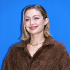 Gigi Hadid in a bob haircut smiling.