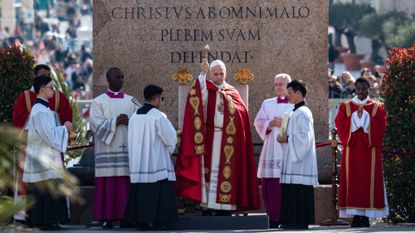 Pope Leo XIV blesses the crowd on Palm Sunday