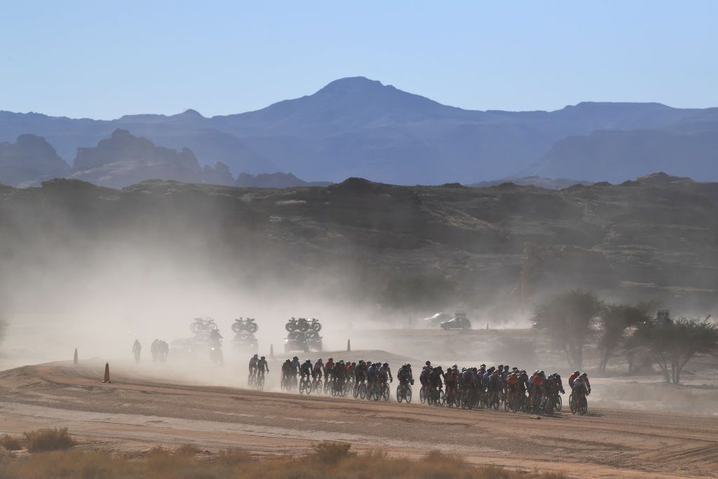 ALULA SAUDI ARABIA FEBRUARY 01 A general view of the peloton passing through Hegra cobblestones sector UNESCO heritage in Al Ula during the 6th Saudi Tour 2022 Stage 1 a 198km stage from Winter park to Winter park SaudiTour on February 01 2022 in AlUla Saudi Arabia Photo by Tim de WaeleGetty Images