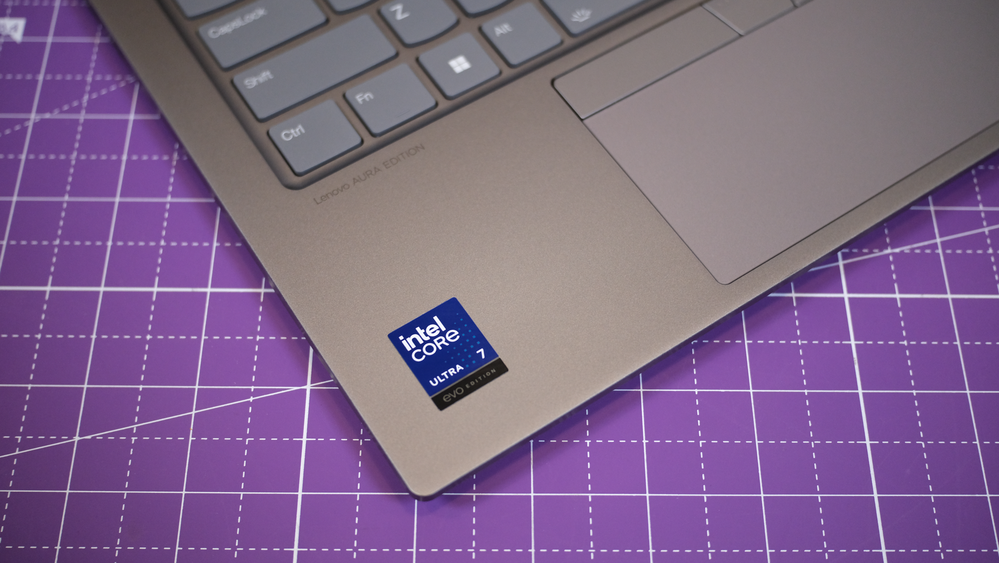 The ThinkPad X1 2-in-1 Gen 10 Aura Edition sitting on a purple table.