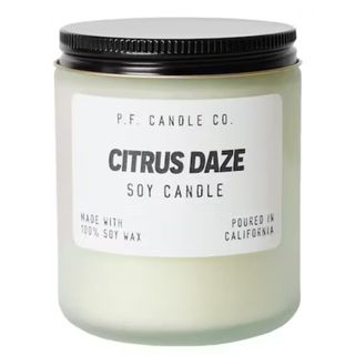 P.F Candle Co's citrus daze candle in a small jar on a white background
