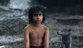 The Jungle Book Mowgli and wolf cub in the rain