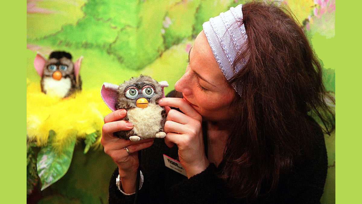 Furby being held by a girl