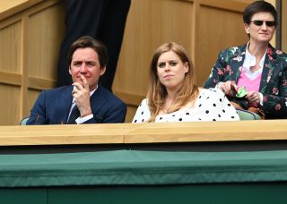 Edoardo and Beatrice seated in the royal box at Wimbledon 2021.