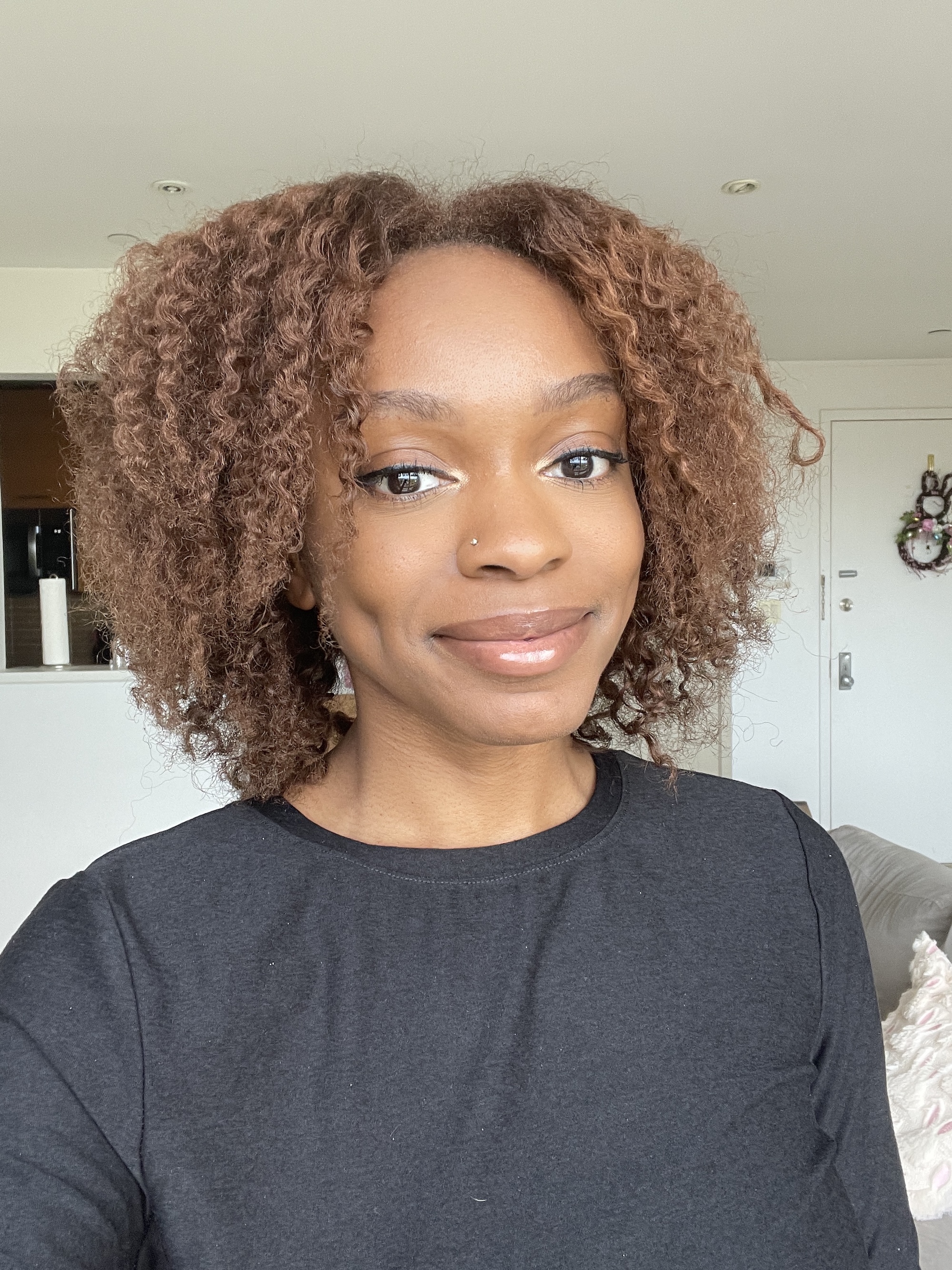 a black woman with brown curly hair