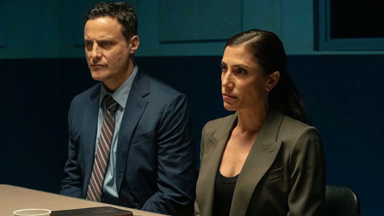 The detectives in the interrogation room.
