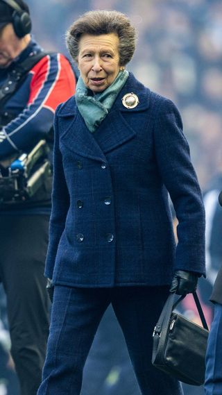 Princess Anne walks across the pitch at the Guinness Six Nations match between Scotland and Italy on February 01, 2025