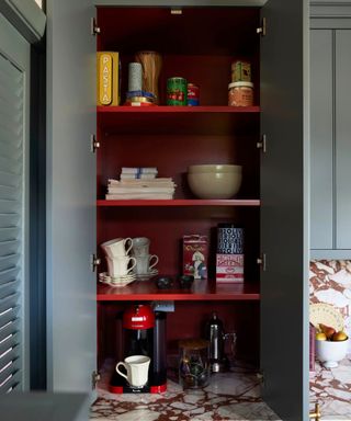 blue kitchen with burgundy red cabinet interior