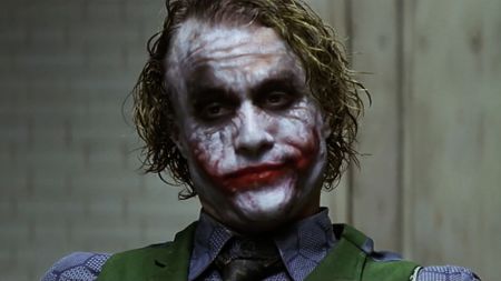 The Joker (Heath Ledger) speaks to Batman in The Dark Knight.