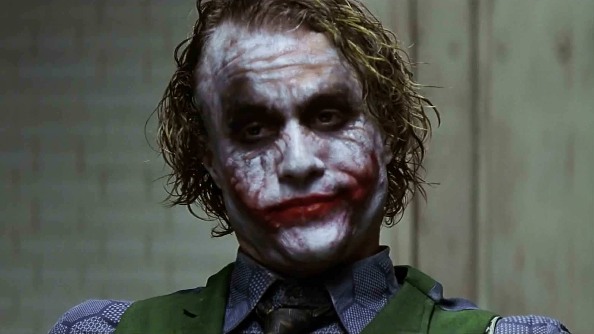 The Joker (Heath Ledger) speaks to Batman in The Dark Knight.
