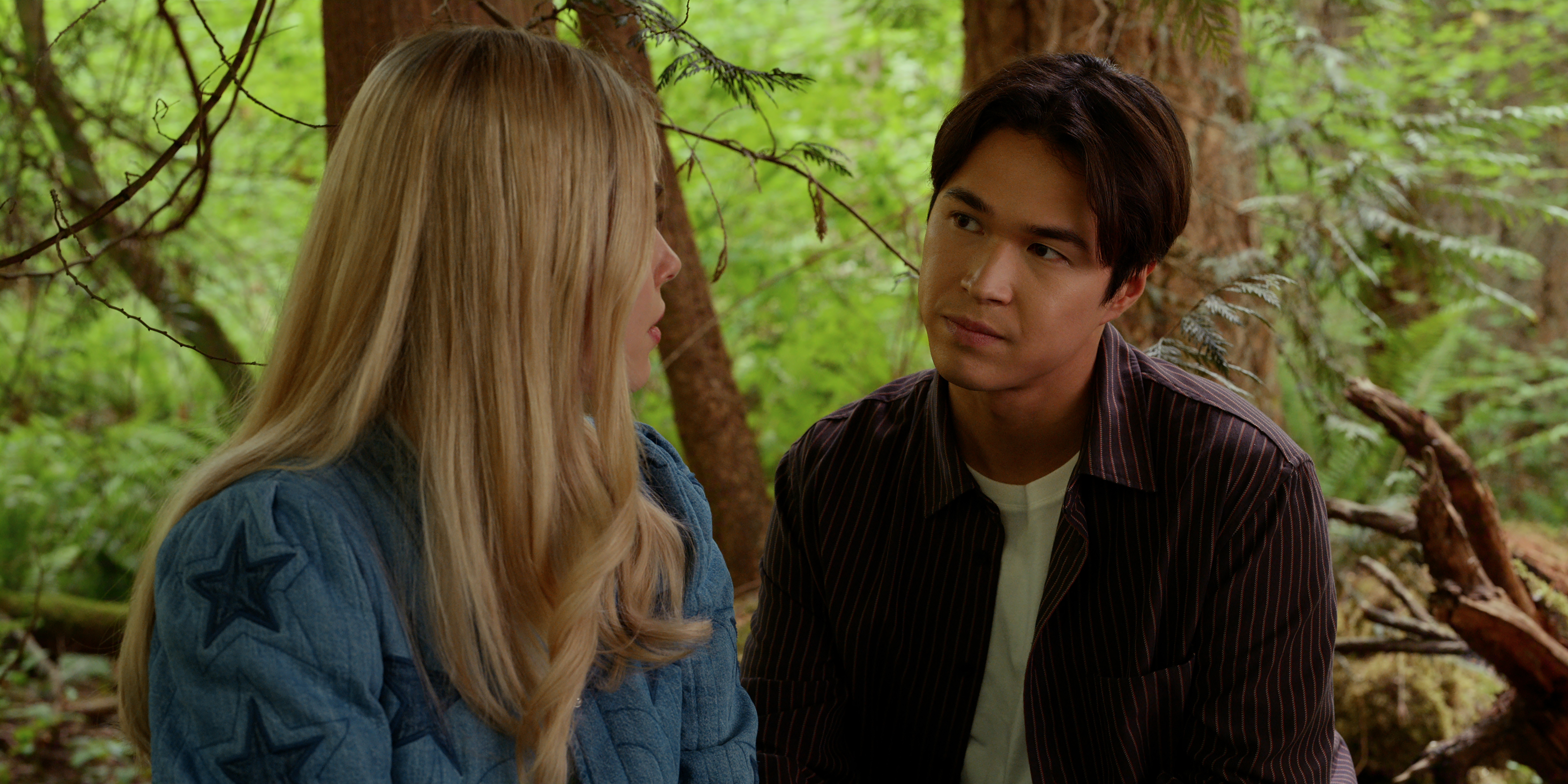 Alexandra Breckenridge as Melinda Monroe and Kai Bradbury as Denny Cutler talking in the woods in virgin river season 7