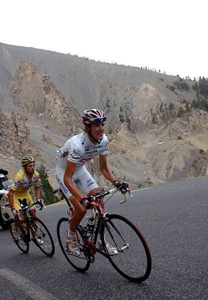 Andy Schleck (Team CSC) digs hard with Gilberto Simoni (Saunier Duval-Prodir) following.