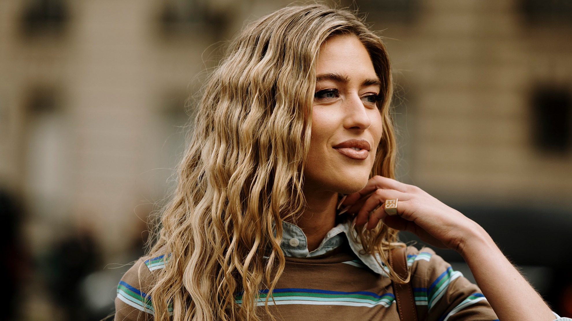 a woman with blonde wavy hair