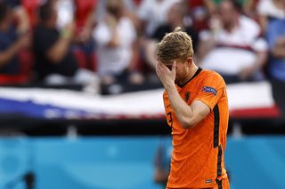 Netherlands defender Matthijs de Ligt holds his head after he is sent off in his side's defeat to the Czech Republic at Euro 2020.