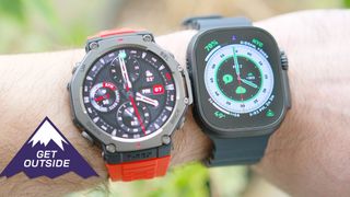 Apple Watch Ultra 2 on a black silicone strap and Amazfit T-Rex 3 on an orange silicone strap shown side-by-side on a user's wrist