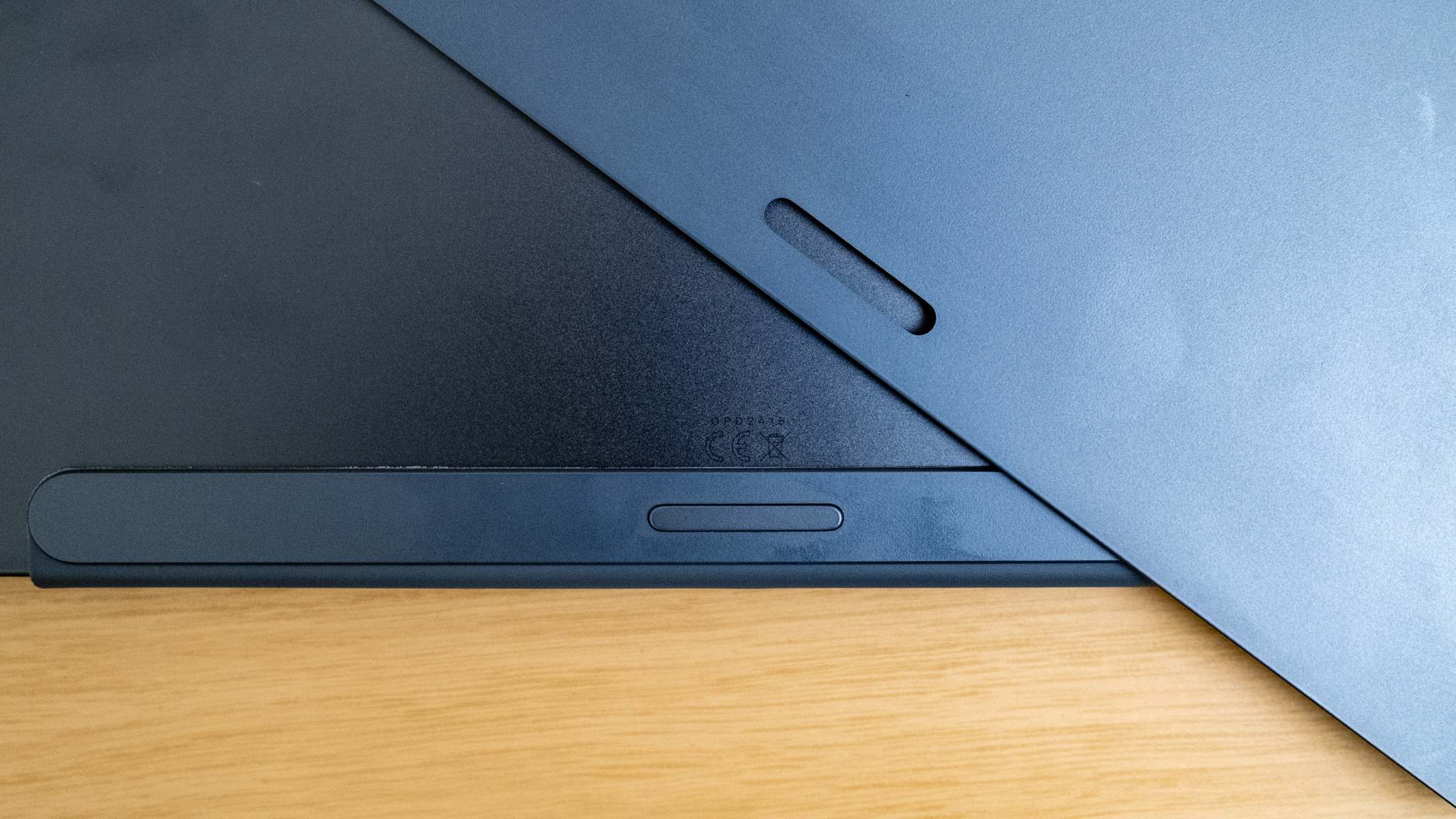 OnePlus Pad 3 keyboard case detail on a wooden table