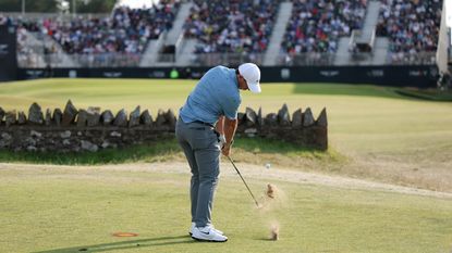 Rory McIlroy hits an approach into the final green at the Genesis Scottish Open