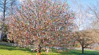 A tree covered in Easter eggs