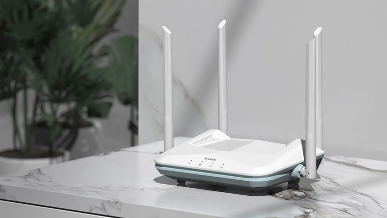 D-Link R15 Smart Router in white positioned on top of a white marble table top