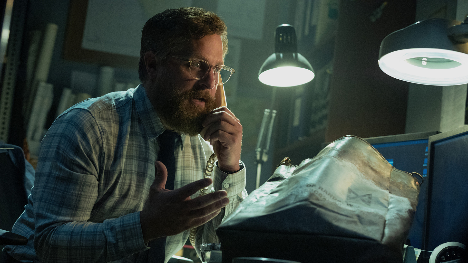 Tim speaking to someone on the phone in Monarch: Legacy of Monsters season 2 episode 5