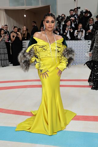 Ariana Debose in a yellow and black Prabal Gurung gownon the Met Gala 2023 red carpet