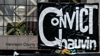 Members of the National Guard and other law enforcement officers stand outside the Hennepin County Government Center as the verdict is announced in the trial of former police officer Derek Chauvin in Minneapolis, Minnesota on April 20, 2021.