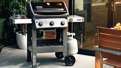 One of the best grills, the Weber Spirit II E-310, in a modern yard