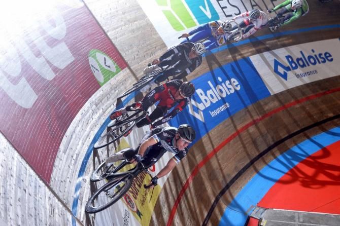 The riders start getting higher on the banking as they ride around