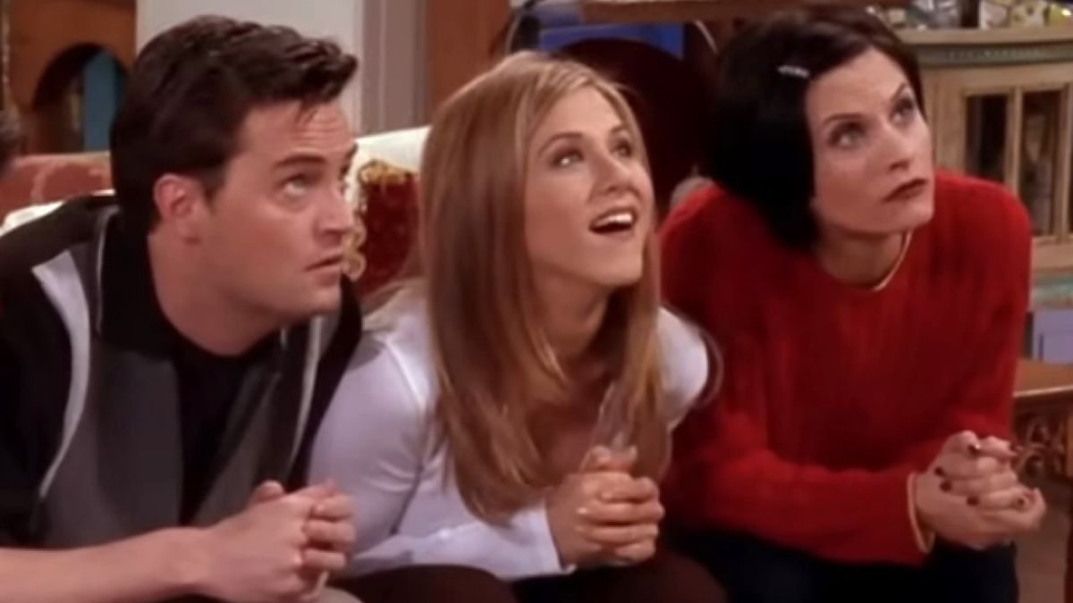 Chandler Bing (Matthew Perry), Rachel Green (Jennifer Aniston) and Monica Gellar (Courteney Cox) all look up in anticipation on the Friends episode &quot;The One Where They Switch Apartments.&quot;