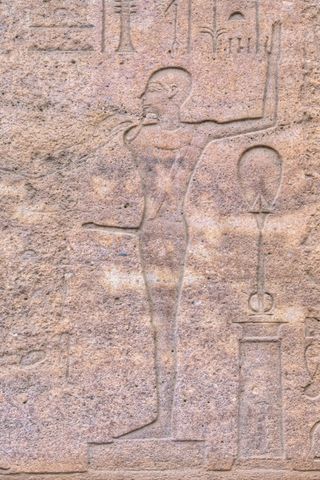 carving of the god Min in the Karnak Temple