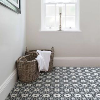 Patterned peel and stick floor fitted in a laundry room. 