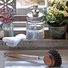 flower pot with white cloth and brush