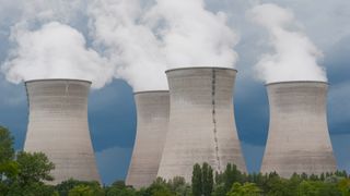 Smoking cooling towers of a nuclear power plant in Rhone, France.