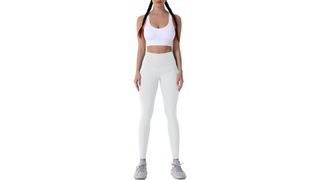 A model wearing high-waisted white leggings for the best leggings on Amazon.