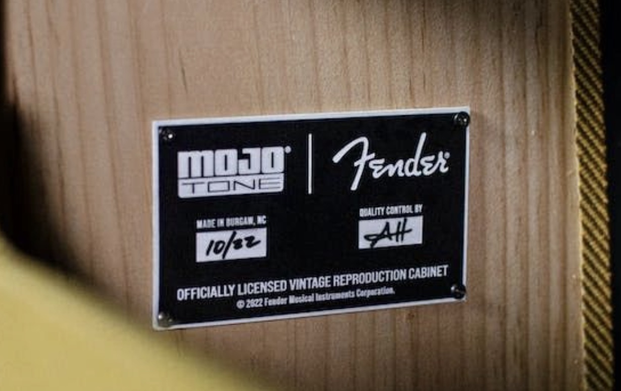 An emblem featuring Mojotone and Fender's logos