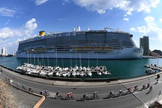 SANREMO ITALY MARCH 20 The Peloton passing through Savona City during the 112th MilanoSanremo 2021 a 299km race from Milano to Sanremo Landscape Harbour Boat MilanoSanremo La Classicissima UCIWT on March 20 2021 in Sanremo Italy Photo by Tim de WaeleGetty Images