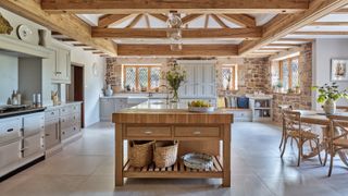 large kitchen island in kitchen with wooden vaulted ceiling