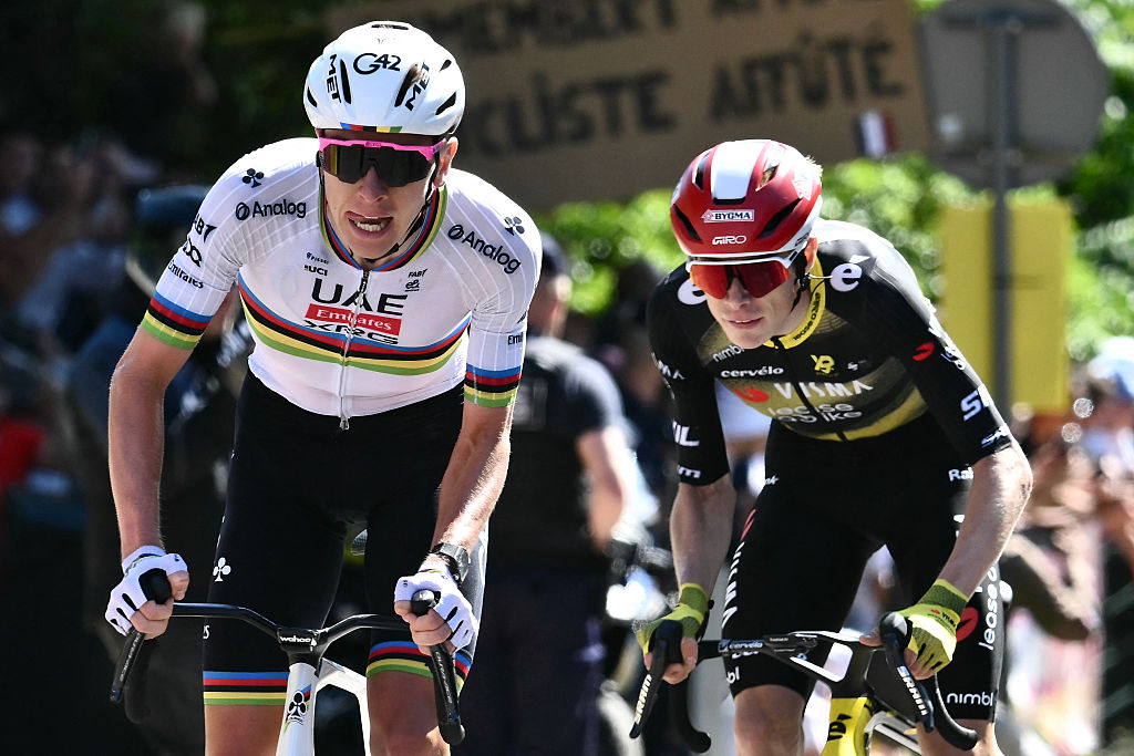 UAE Team Emirate - XRG team's Slovenian rider Tadej Pogacar (L) attacks, as Team Visma - Lease a bike team's Danish rider Jonas Vingegaard pursues in the ascent of Rampe Saint-Hilaire cycles during the 4th stage of the 112th edition of the Tour de France cycling race, 174.2 km between Amiens Metropole and Rouen, Northern France, on July 8, 2025. (Photo by Marco BERTORELLO / AFP) (Photo by MARCO BERTORELLO/AFP via Getty Images)