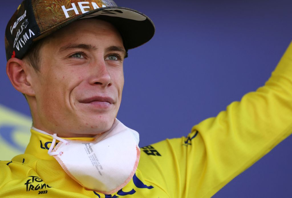 JumboVisma teams Danish rider Jonas Vingegaard celebrates with the overall leaders yellow jersey on the podium after the 18th stage of the 109th edition of the Tour de France cycling race 1432 km between Lourdes and Hautacam in the Pyrenees mountains in southwestern France on July 21 2022 Photo by Thomas SAMSON AFP Photo by THOMAS SAMSONAFP via Getty Images