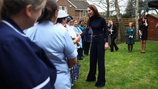 Catherine, Princess of Wales shakes people's hands as she visits the Oxford House Nursing Home in 2023