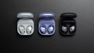 Three pairs of the Samsung Galaxy Buds Pro in three different colors, white, violet and black.