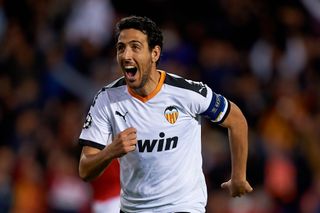 Dani Parejo celebrates after scoring a penalty for Valencia against Lille in the Champions League in November 2019.