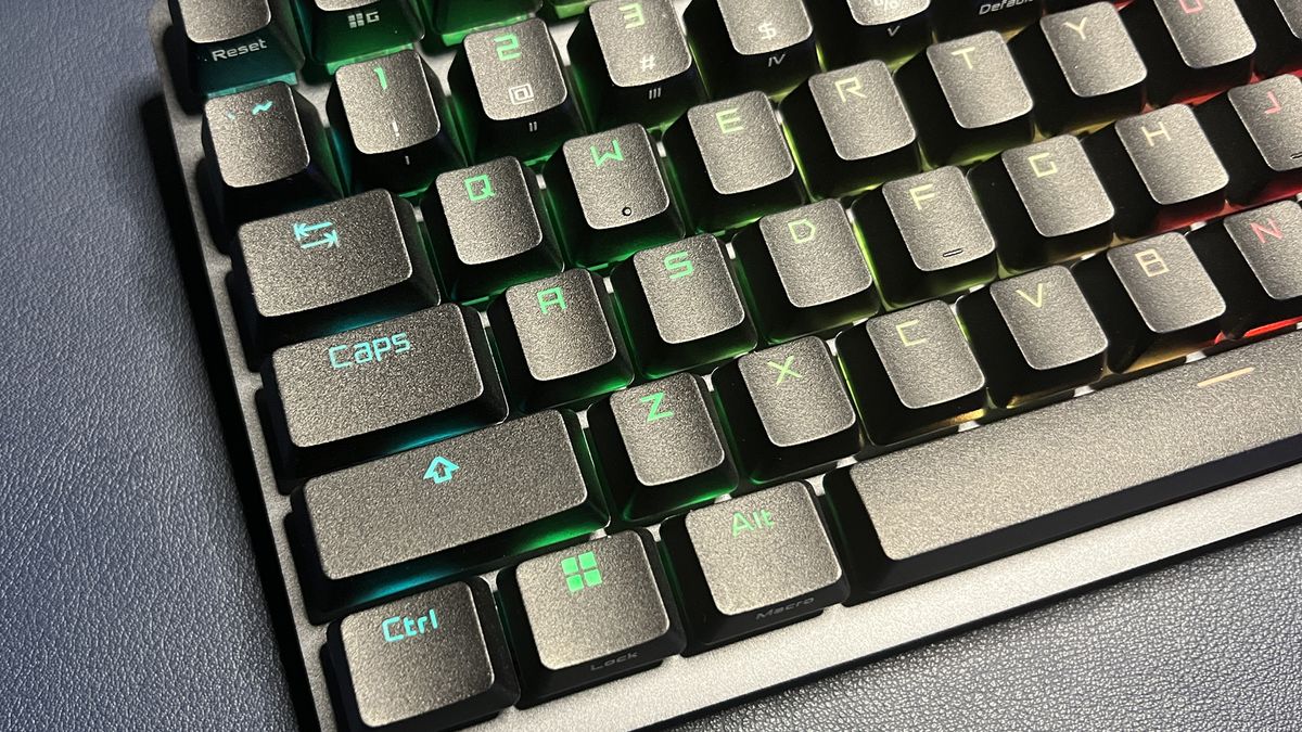 close up of the left side of a black Asus gaming keyboard with RGB lighting