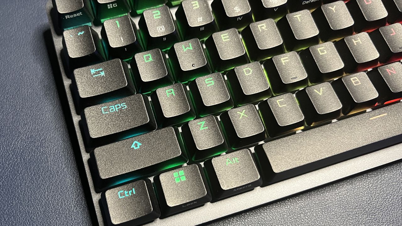 close up of the left side of a black Asus gaming keyboard with RGB lighting